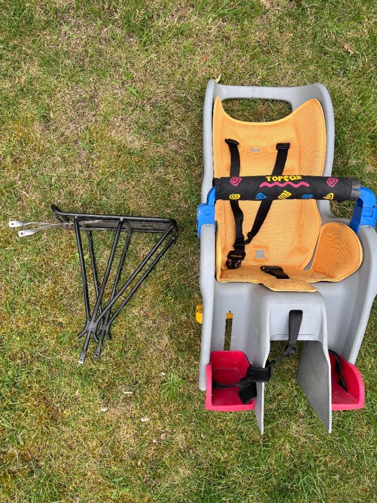 Grey and yellow bicycle child seat with mounting rack for