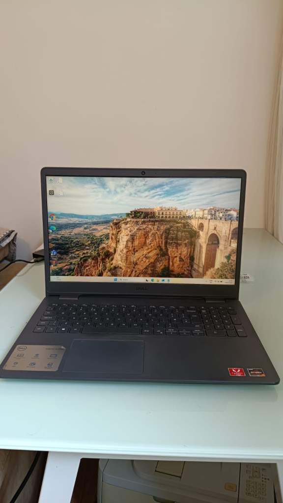 Black Laptop with Backlit Keyboard and Windows Desktop
