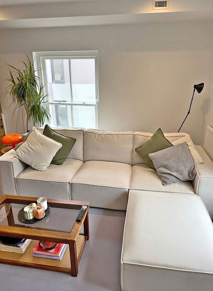 White L-Shaped Sofa with Footstool and Throw Pillows606182571886530562